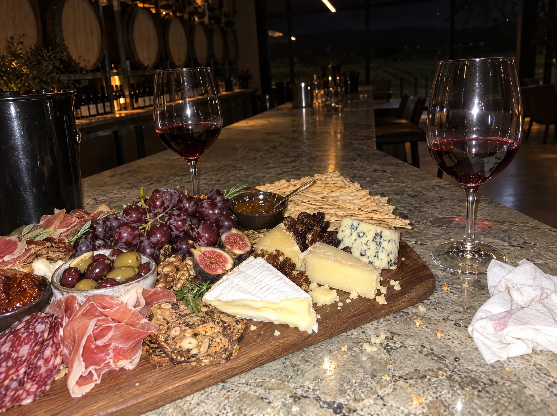 Original: A grazing board and a glass of red on the bar, shot close and dim