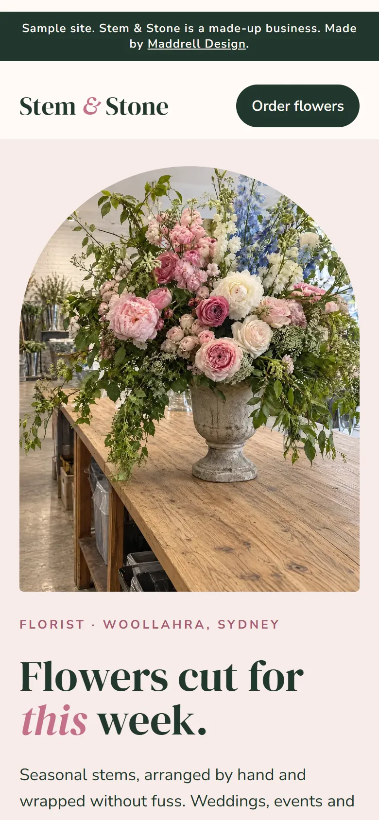 Stem and Stone sample florist site on a phone: a round-topped photo of a large pink bouquet above the headline, Flowers cut for this week